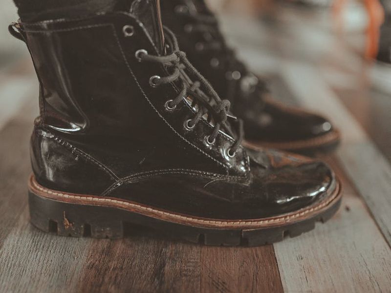 Detailed close-up of high-quality training shoes on a wooden floor.